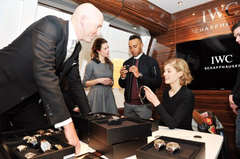 GENEVA, SWITZERLAND - JANUARY 19:   IWC head designer Christian Knoop, IWC Schaffhausen CMO Franziska Gsell, Lewis Hamilton and Rosamund Pike visit the IWC booth during the launch of the Pilot's Watches Novelties from the Swiss luxury watch manufacturer IWC Schaffhausen at the Salon International de la Haute Horlogerie (SIHH) 2016 on January 19, 2016 in Geneva, Switzerland.  (Photo by Harold Cunningham/Getty Images for IWC)