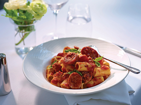 Rigatoni with Tuscan sausage in spicy tomato sauce, sprinkled with Parmesan